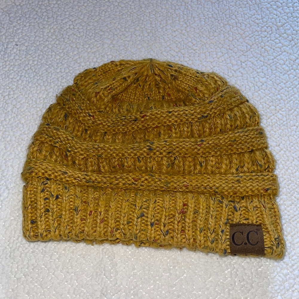 Mustard color CC beanie.